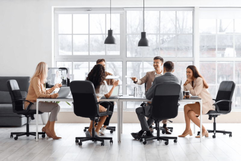 human resources staff gather around a desk