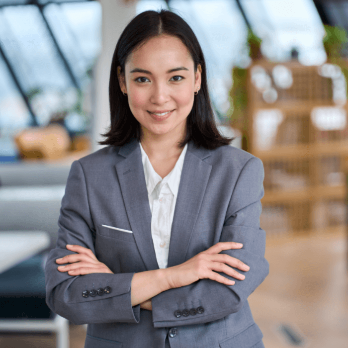 sales staffing represented by a woman in a business suit looking into the camera